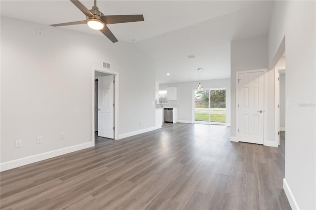 unfurnished living room featuring a ceiling fan, visible vents, wood finished floors, baseboards, and high vaulted ceiling