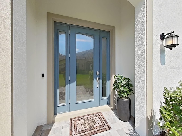 4300 Barletta Ct, Wesley Chapel, FL 33543 - doorway to property with stucco siding and french doors