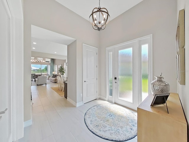 4300 Barletta Ct, Wesley Chapel, FL 33543 - entryway featuring a chandelier, light tile patterned floors, and baseboards