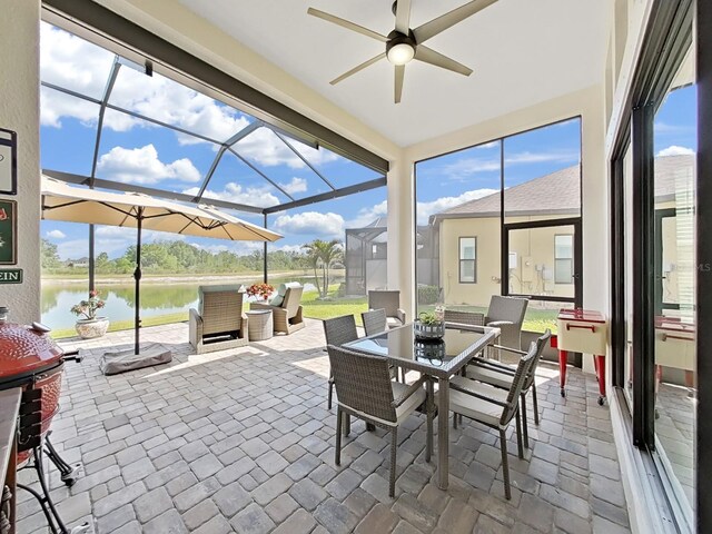 4300 Barletta Ct, Wesley Chapel, FL 33543 - sunroom / solarium featuring a ceiling fan, a water view, outdoor dining space, and healthy amount of natural light