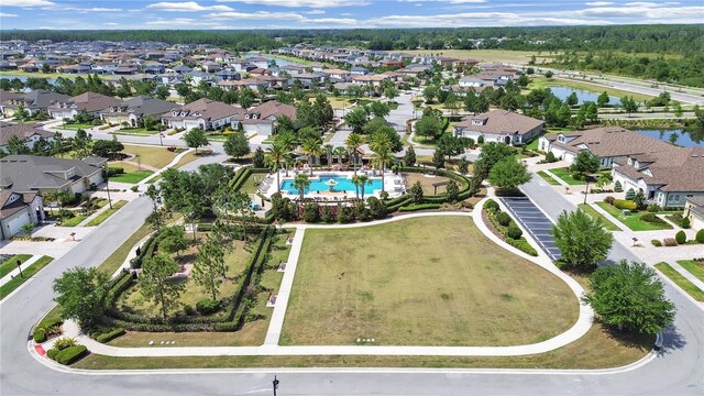 4300 Barletta Ct, Wesley Chapel, FL 33543 - aerial overview of property's location featuring a pool area, a large body of water, and nearby suburban area