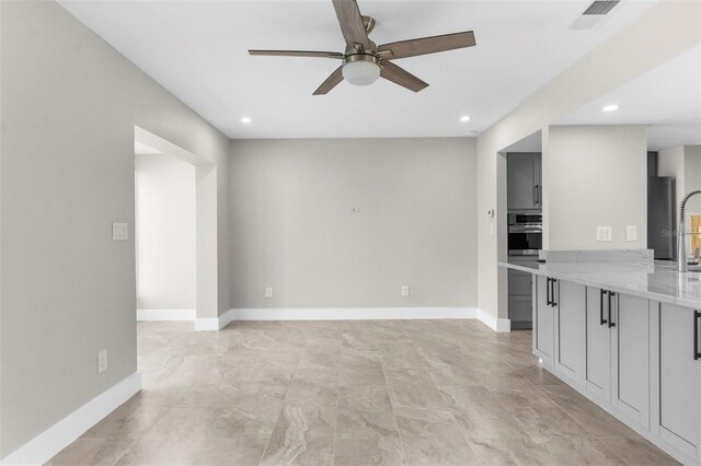 105 E Davis Blvd Unit A, Tampa, FL 33606 - unfurnished living room with a ceiling fan, baseboards, visible vents, and recessed lighting