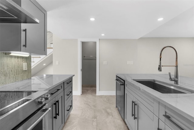 105 E Davis Blvd Unit A, Tampa, FL 33606 - kitchen with electric range, dishwashing machine, wall chimney range hood, light stone counters, and a sink