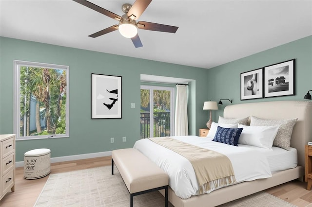 105 E Davis Blvd Unit A, Tampa, FL 33606 - bedroom featuring access to outside, light wood-style floors, and multiple windows