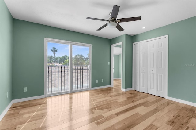 105 E Davis Blvd Unit A, Tampa, FL 33606 - unfurnished bedroom featuring light wood-style floors, baseboards, and a closet
