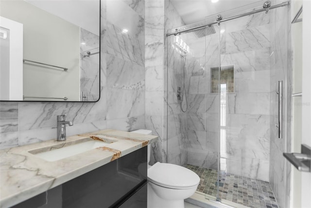 105 E Davis Blvd Unit A, Tampa, FL 33606 - full bathroom featuring tile walls, vanity, toilet, and a marble finish shower