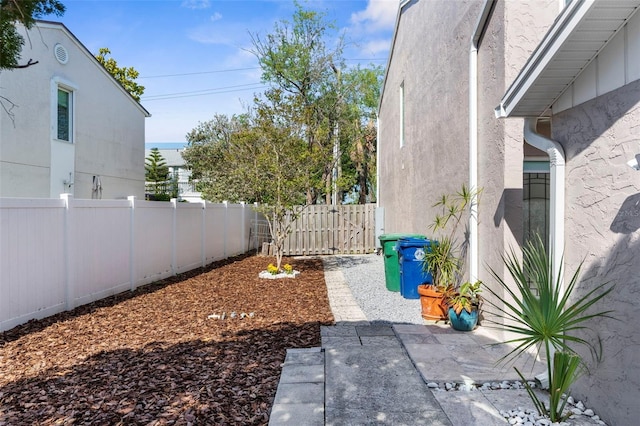 105 E Davis Blvd Unit A, Tampa, FL 33606 - view of yard featuring a fenced backyard and a patio