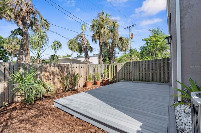 105 E Davis Blvd Unit A, Tampa, FL 33606 - wooden terrace with a fenced backyard and central AC unit