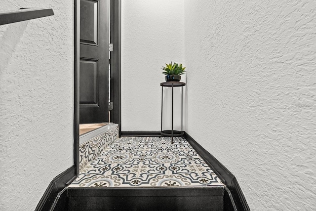 interior space featuring a textured wall