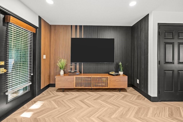 living area featuring recessed lighting, baseboards, and radiator