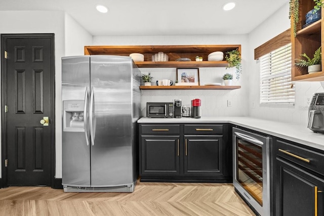 interior space with recessed lighting, stainless steel fridge, and wine cooler