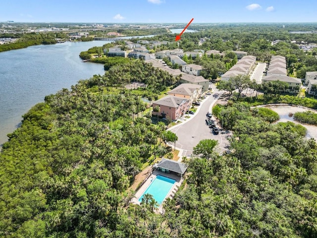 birds eye view of property with a water view