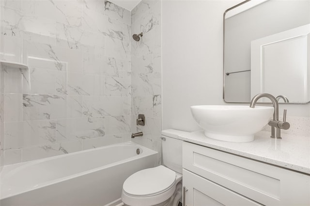 bathroom with shower / bathtub combination, vanity, and toilet