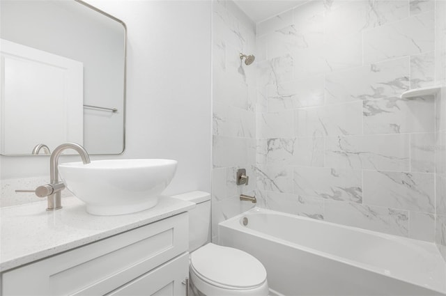 full bathroom featuring vanity, washtub / shower combination, and toilet