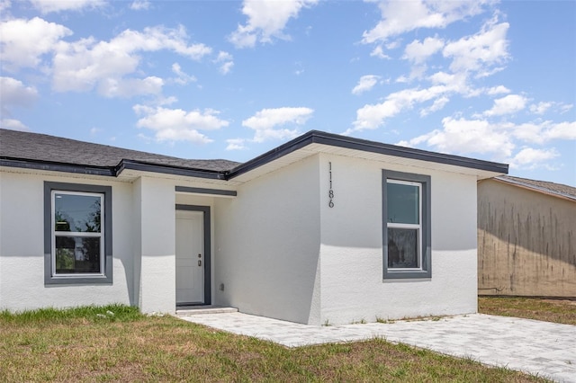 view of front of property featuring stucco siding