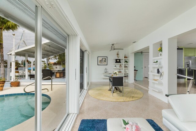 2487 W Bay Isle Dr SE, Saint Petersburg, FL 33705 - interior space with a ceiling fan and an outdoor pool