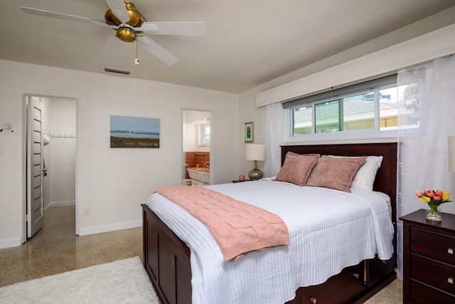 2487 W Bay Isle Dr SE, Saint Petersburg, FL 33705 - bedroom featuring a walk in closet, ensuite bath, a ceiling fan, baseboards, and visible vents