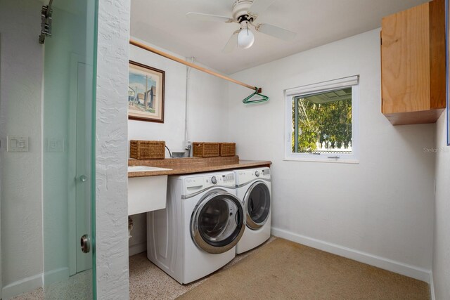 2487 W Bay Isle Dr SE, Saint Petersburg, FL 33705 - washroom featuring cabinet space, ceiling fan, light colored carpet, separate washer and dryer, and baseboards