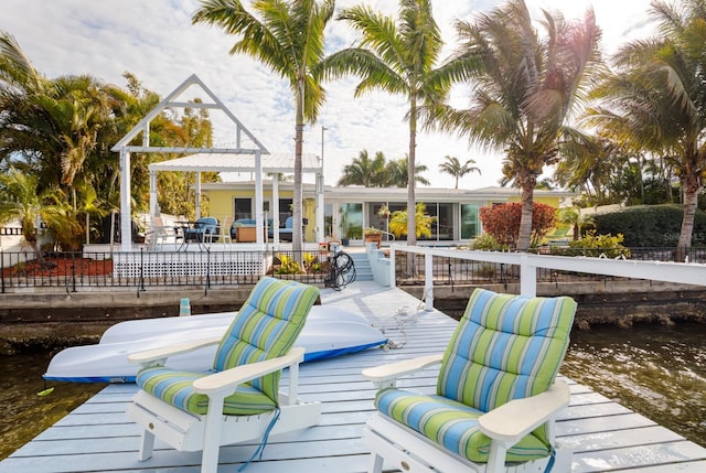 2487 W Bay Isle Dr SE, Saint Petersburg, FL 33705 - view of dock with a deck with water view and a patio area