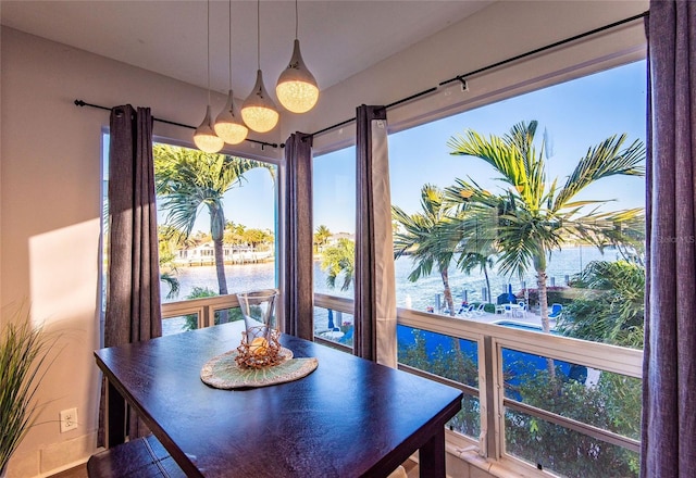 dining space with a water view
