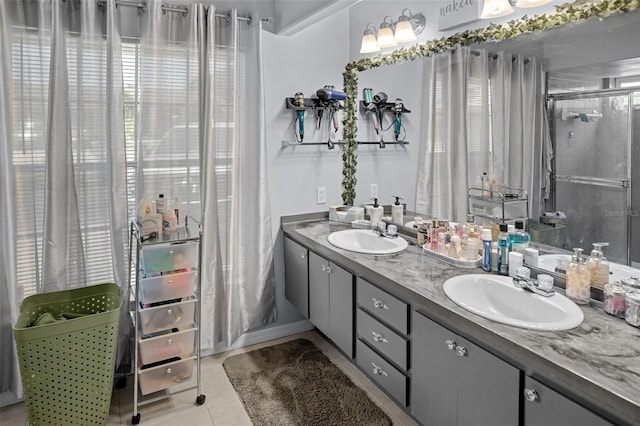8712 Ashbury Dr, Hudson, FL 34667 - bathroom with double vanity, a sink, walk in shower, and tile patterned floors