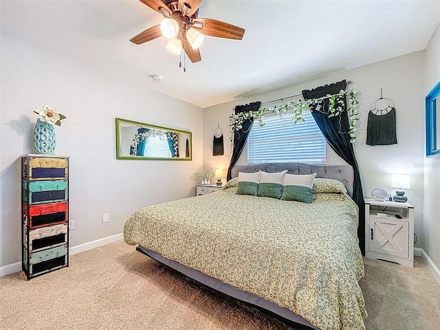 149 Sky Loch Dr E, Dunedin, FL 34698 - bedroom featuring baseboards, a ceiling fan, and light colored carpet