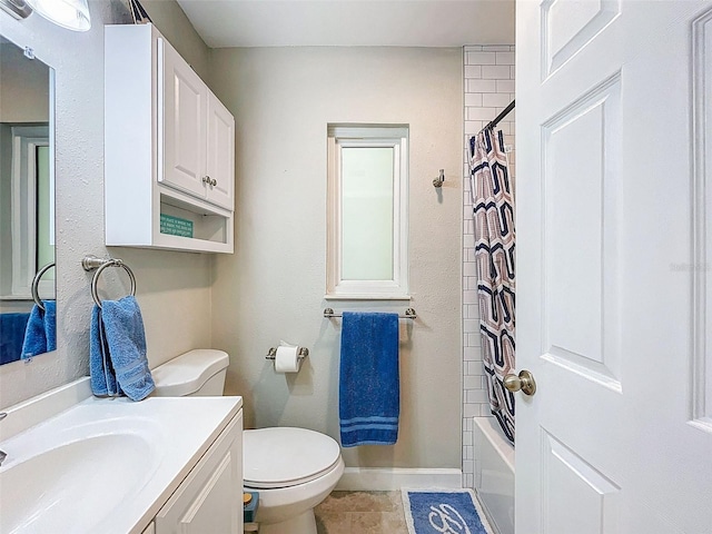 149 Sky Loch Dr E, Dunedin, FL 34698 - bathroom with tile patterned flooring, shower / bath combo, vanity, baseboards, and toilet