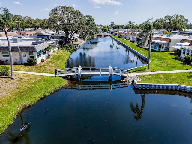 149 Sky Loch Dr E, Dunedin, FL 34698 - dock area with a water view, a yard, and a residential view