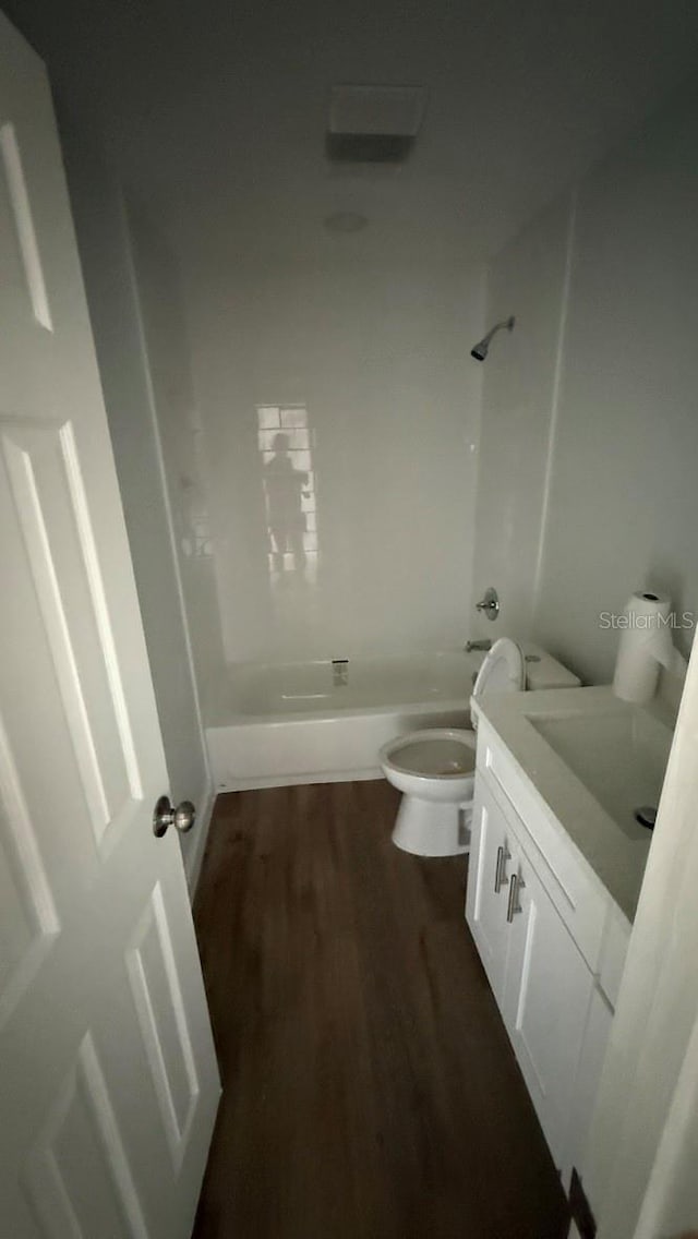 3188 Lake Saxon Dr, Land O Lakes, FL 34639 - bathroom with toilet, shower / tub combination, wood finished floors, and vanity