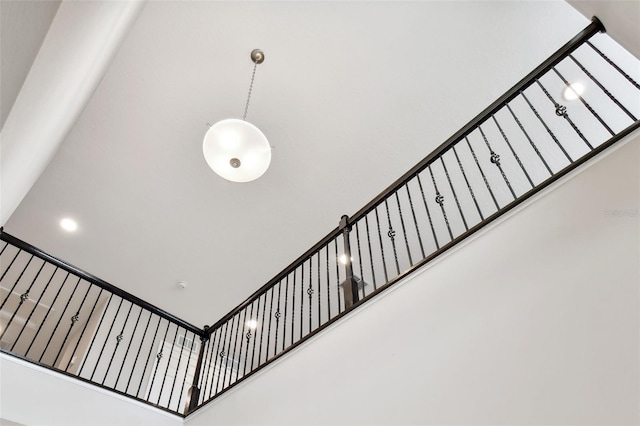 stairway with a towering ceiling