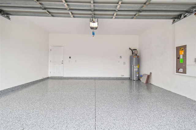 garage with a garage door opener, electric panel, and electric water heater