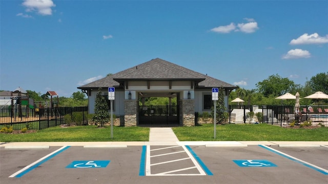 uncovered parking lot featuring fence