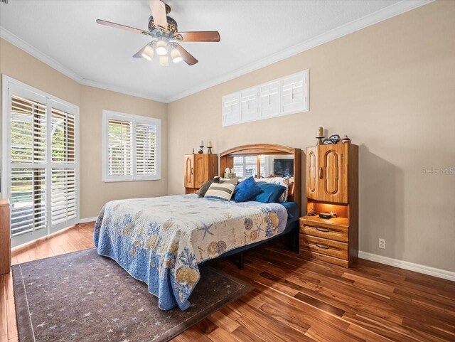 bedroom featuring crown molding, baseboards, ceiling fan, and hardwood / wood-style flooring