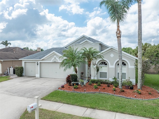 29542 Forest Glen Dr, Wesley Chapel, FL 33543 - ranch-style house with a shingled roof, an attached garage, a front lawn, stucco siding, and driveway
