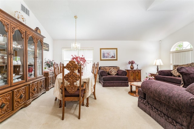 29542 Forest Glen Dr, Wesley Chapel, FL 33543 - dining room featuring an inviting chandelier, vaulted ceiling, visible vents, and light carpet