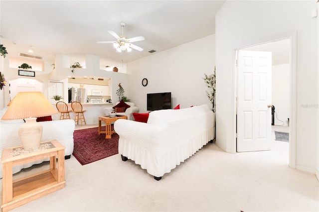 29542 Forest Glen Dr, Wesley Chapel, FL 33543 - living room with visible vents, ceiling fan, light colored carpet, and vaulted ceiling