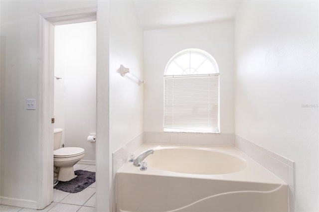 29542 Forest Glen Dr, Wesley Chapel, FL 33543 - full bathroom with toilet, tile patterned flooring, and a garden tub