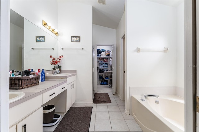 29542 Forest Glen Dr, Wesley Chapel, FL 33543 - full bath with tile patterned flooring, double vanity, a garden tub, a spacious closet, and a sink