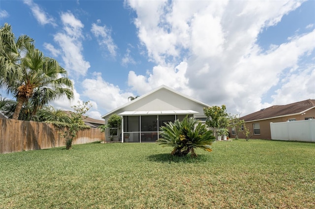 29542 Forest Glen Dr, Wesley Chapel, FL 33543 - rear view of property with a sunroom, a yard, and fence private yard