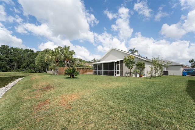 29542 Forest Glen Dr, Wesley Chapel, FL 33543 - view of yard with central AC, fence, and a sunroom