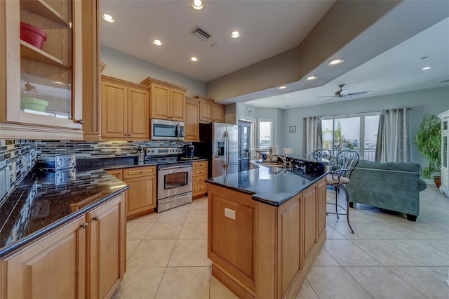 620 Bayway Blvd Unit 1, Clearwater, FL 33767 - kitchen with recessed lighting, a sink, appliances with stainless steel finishes, and backsplash