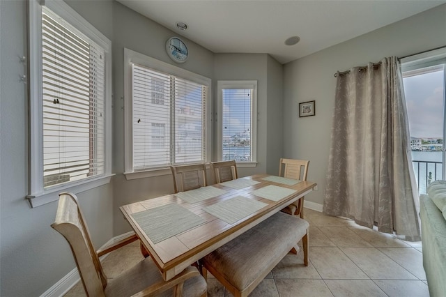 620 Bayway Blvd Unit 1, Clearwater, FL 33767 - dining room featuring baseboards and light tile patterned floors