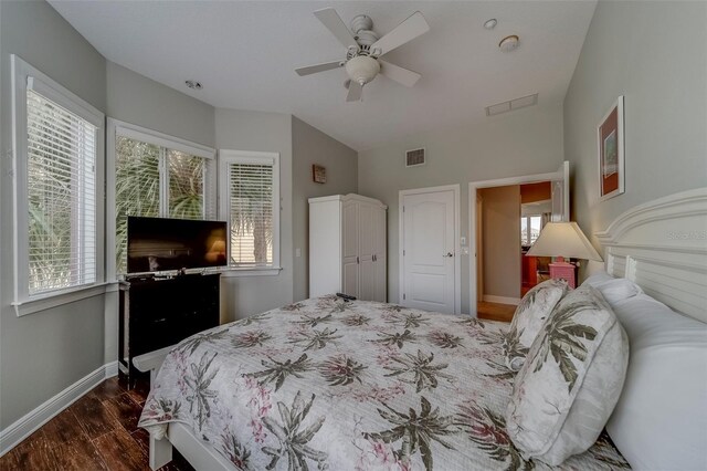 620 Bayway Blvd Unit 1, Clearwater, FL 33767 - bedroom with baseboards, multiple windows, dark wood-style flooring, and visible vents