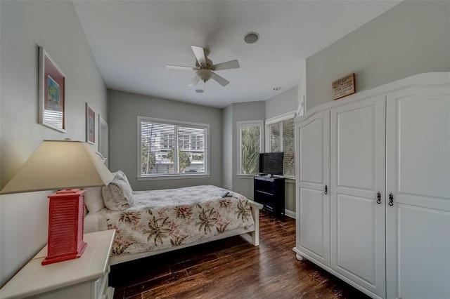 620 Bayway Blvd Unit 1, Clearwater, FL 33767 - bedroom with dark wood-type flooring and ceiling fan