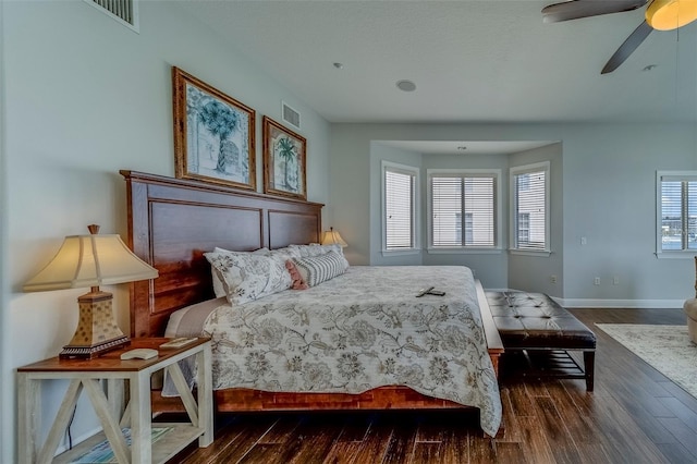 620 Bayway Blvd Unit 1, Clearwater, FL 33767 - bedroom with visible vents, dark wood finished floors, ceiling fan, and baseboards