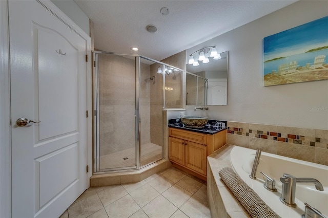 620 Bayway Blvd Unit 1, Clearwater, FL 33767 - bathroom with tile patterned flooring, vanity, recessed lighting, a shower stall, and a bath