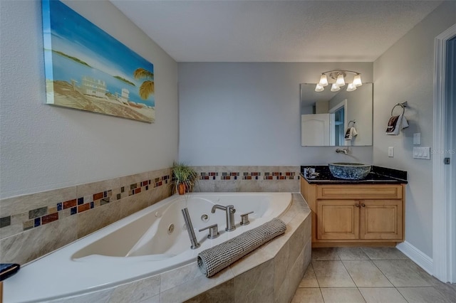 620 Bayway Blvd Unit 1, Clearwater, FL 33767 - bathroom with a whirlpool tub, tile patterned floors, an inviting chandelier, and vanity