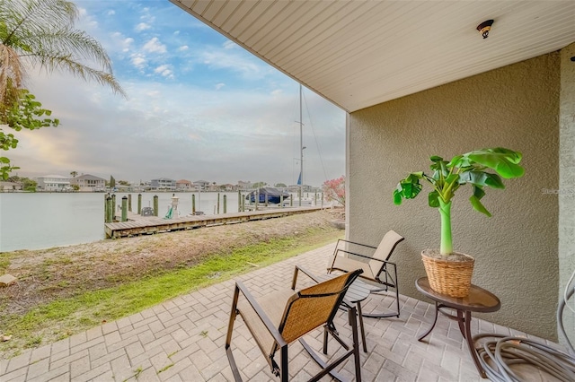 620 Bayway Blvd Unit 1, Clearwater, FL 33767 - view of patio with a water view and a boat dock