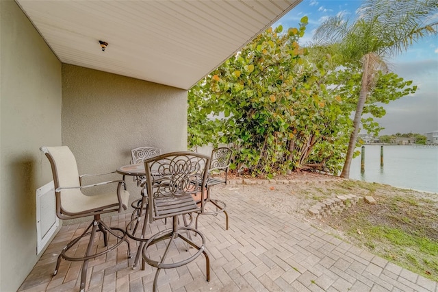 620 Bayway Blvd Unit 1, Clearwater, FL 33767 - exterior space with a water view and outdoor dining area