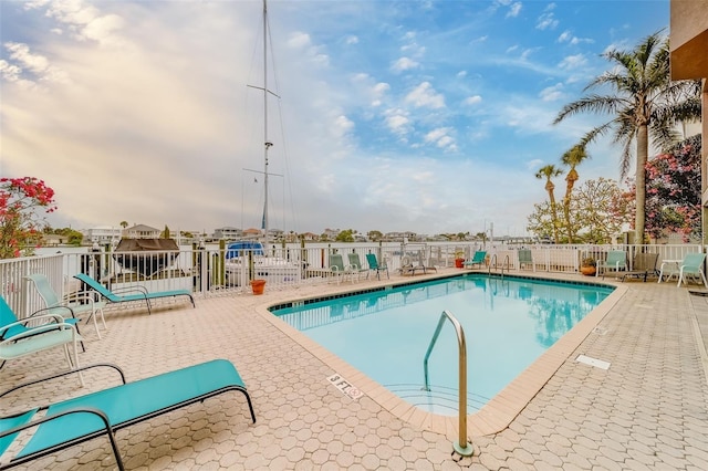 620 Bayway Blvd Unit 1, Clearwater, FL 33767 - pool featuring fence and a patio area